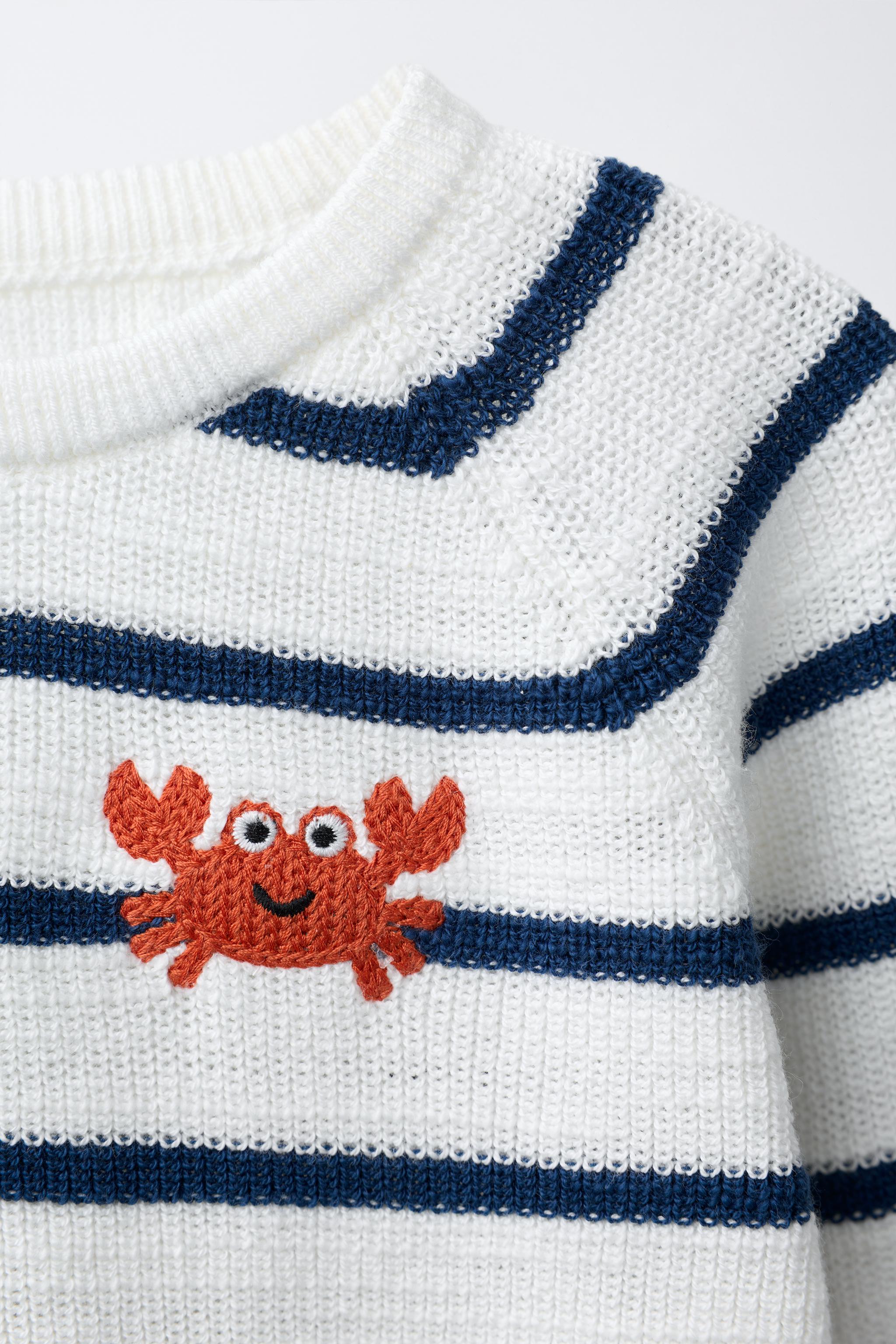 PULL EN MAILLE PERLÉE RAYURES CRABE BRODÉ